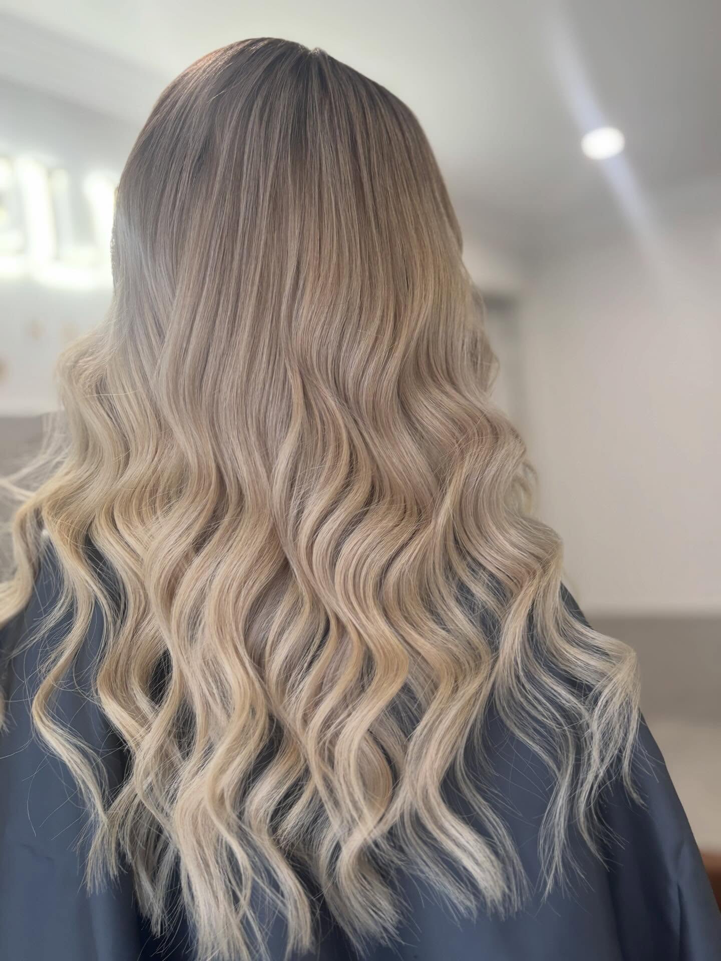 Blonde balayage with soft waves